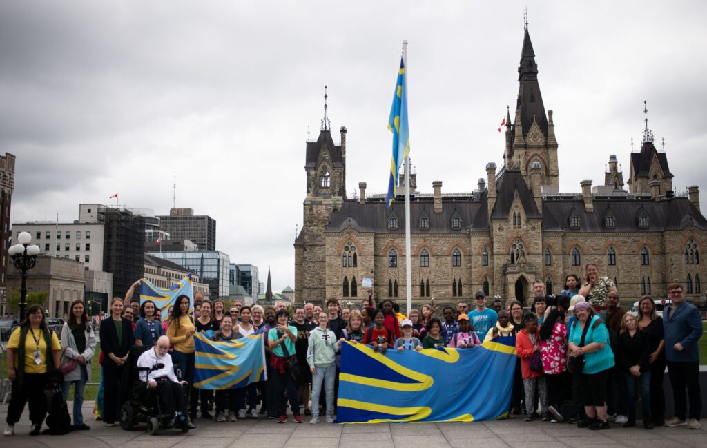 A group of people at Deaf Flag Raising event